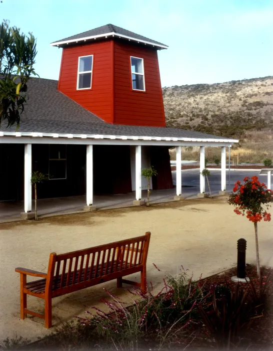 Courtyard with benches in front of the community building Moonridge Village in Santa Cruz, California.