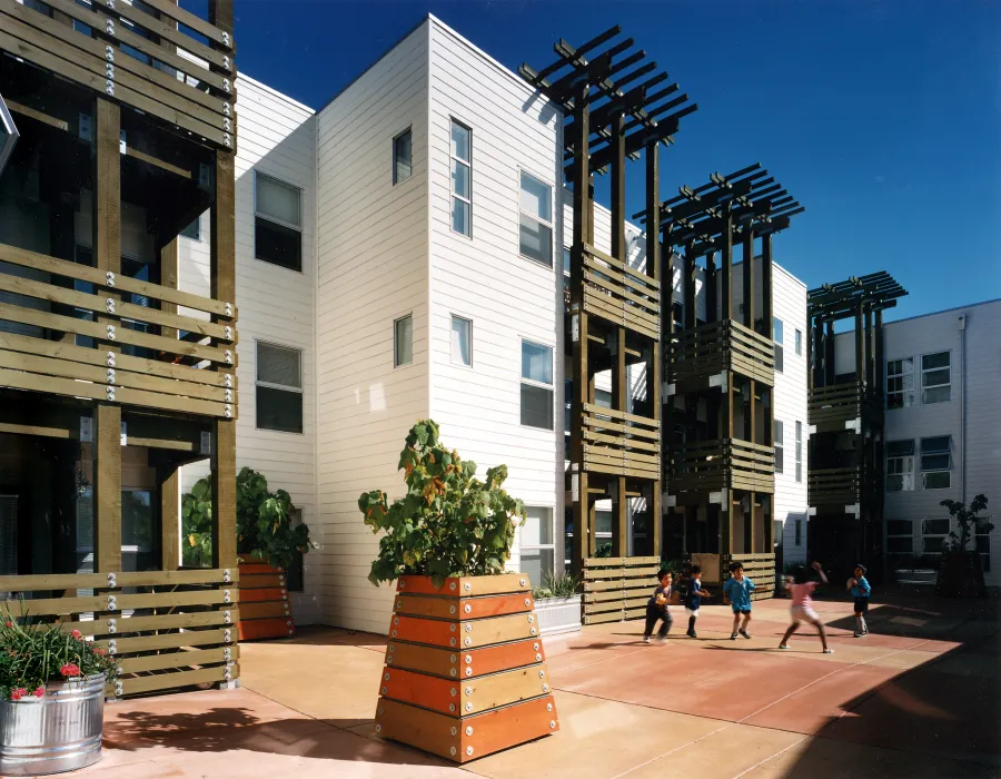 Children playing in the courtyard at Columbia Park in San Francisco. 