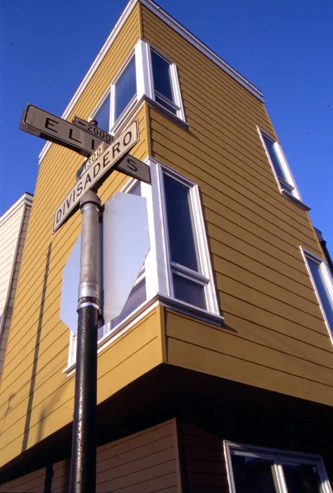 Detail view of the street signs, Ellis and Divisadero with Bell Mews in the background.