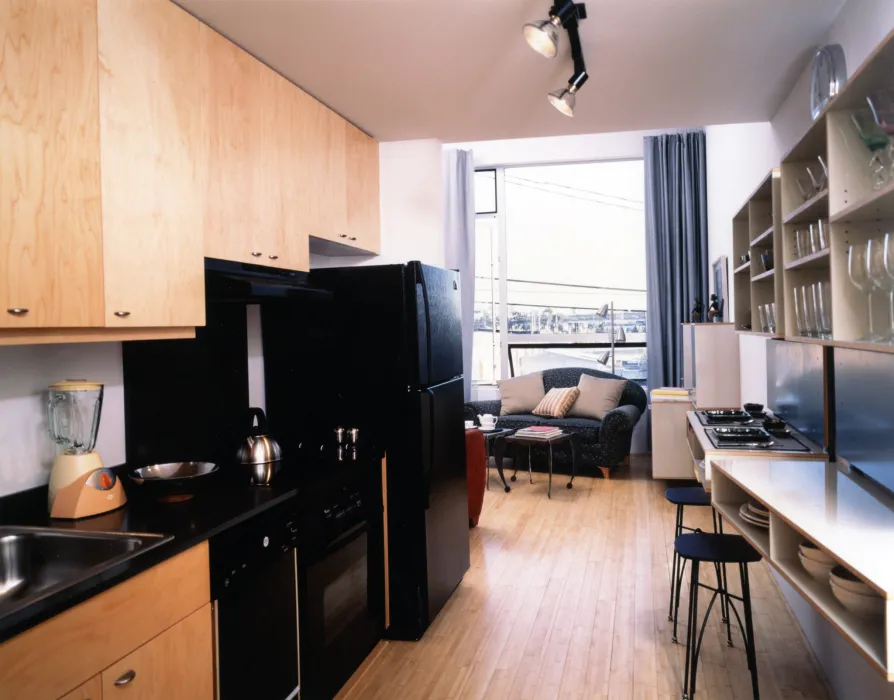 Interior view of a unit kitchen at 1500 Park Avenue Lofts in Emeryville, California.