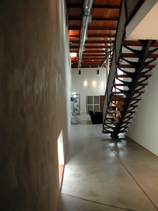 Stairs up to the office loft at 310 Waverly Residence in Palo Alto, California.