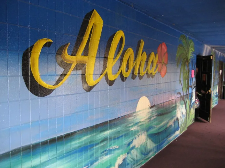 Mural with ocean water and the word "Aloha" written in cursive.
