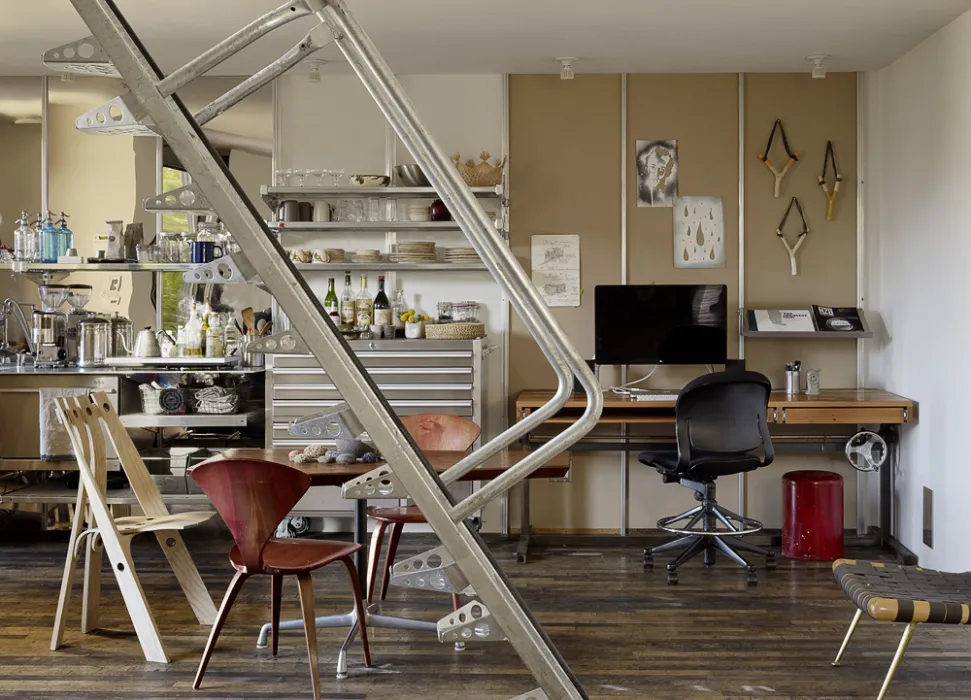 Interior view of the kitchen, dining area, and work space inside Zero Cottage in San Francisco.