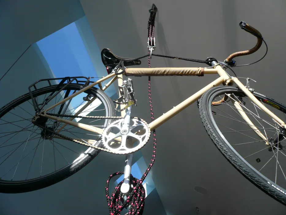 A bike hanging from the ceiling at Shotwell Design Lab in San Francisco.