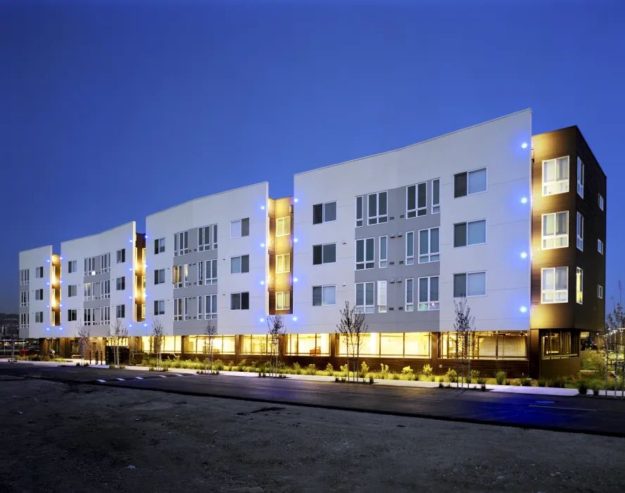 Exterior view at dusk of the north elevation of Ironhorse at Central Station in Oakland, California.