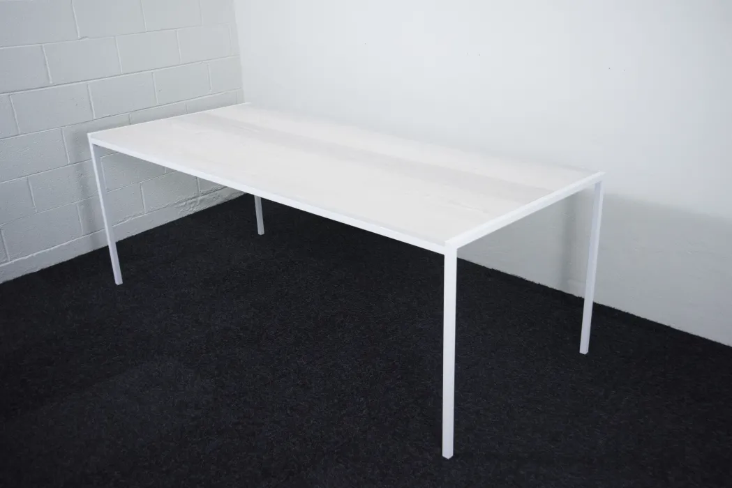 Summit table with a white bleached top.