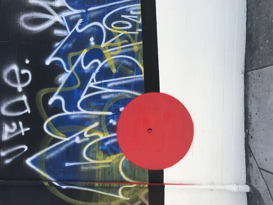 Painted red circle on the wall of David Baker Architects office in Oakland, California.