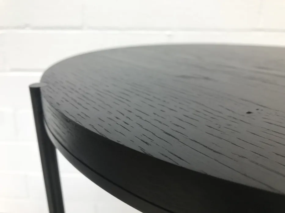 Detail of the black wood coffee table.