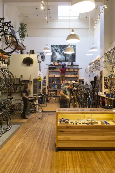 Interior view of bicycles hanging inside Huckleberry Bicycles in San Francisco.