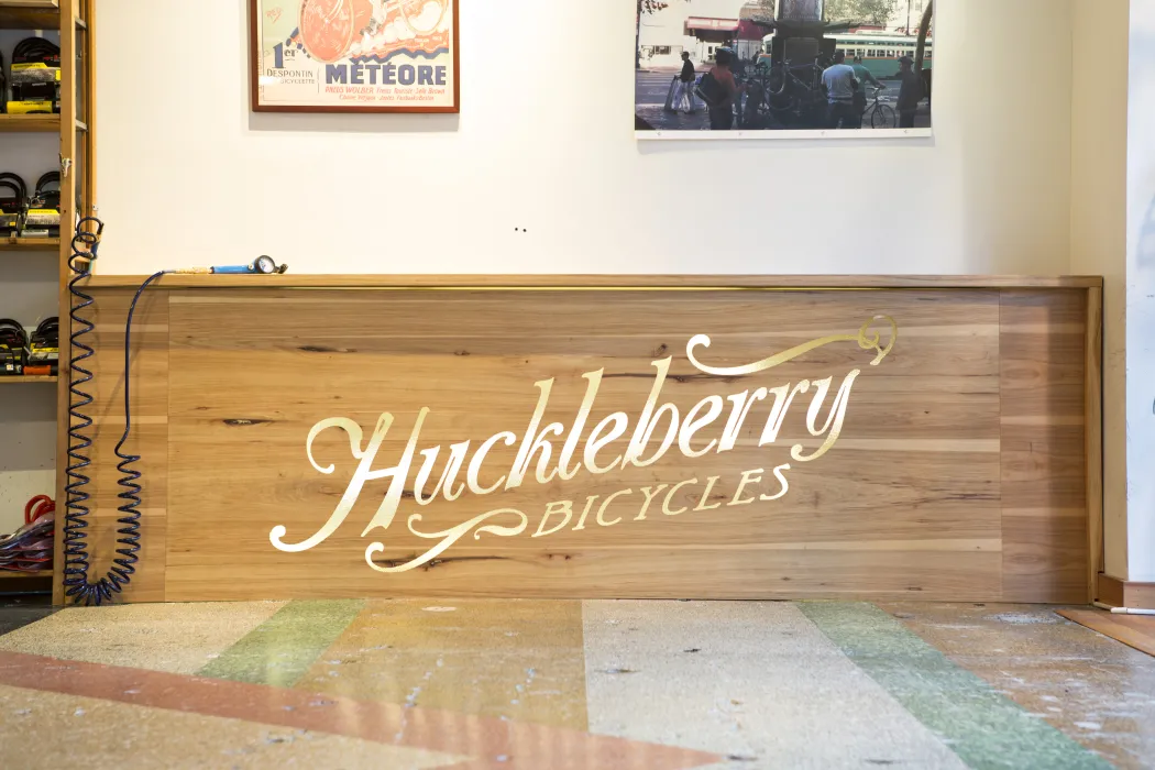 Wood fixture with Huckleberry Bicycle logo on it.