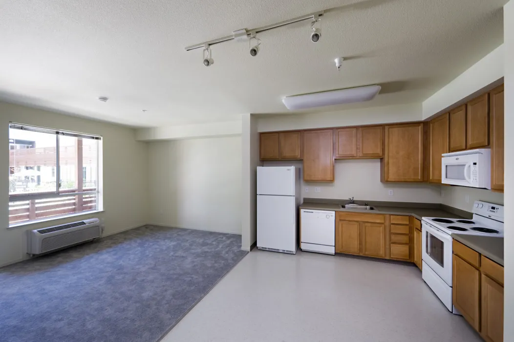 Kitchen and living room interior at Paseo Senter in San Jose, California.