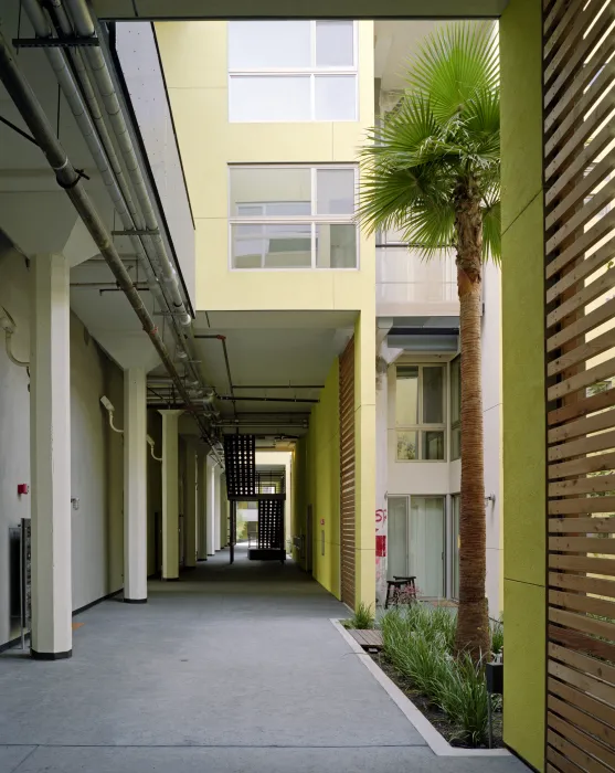 Open-air ground floor hallway at Pacific Cannery Lofts in Oakland, California.