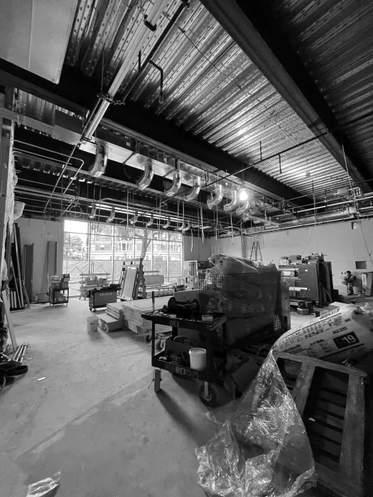 Black and white image  of the interior during the construction of Local 38 Plumbers Union Hall in San Francisco. 