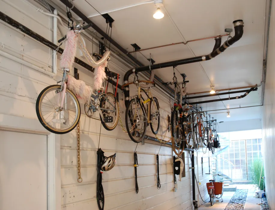 Bikes hanging in the garage at Shotwell Design Lab in San Francisco.