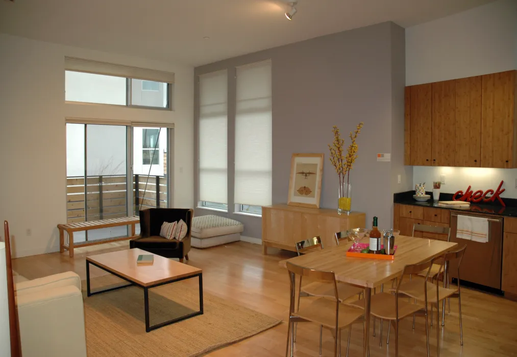 Kitchen and living room interior of a townhome at West End Commons in Oakland, Ca.