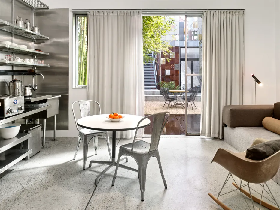 Interior view of the dining and kitchen area at Shotwell Garden Retreat in San Francisco.