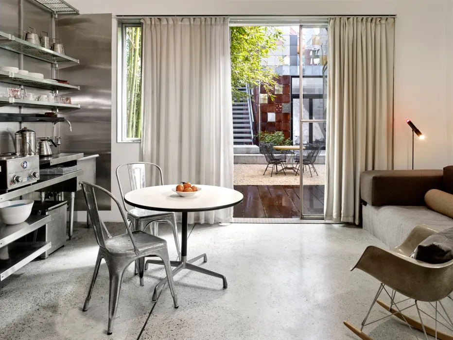 Interior view of the dining and kitchen area at Shotwell Garden Retreat in San Francisco.