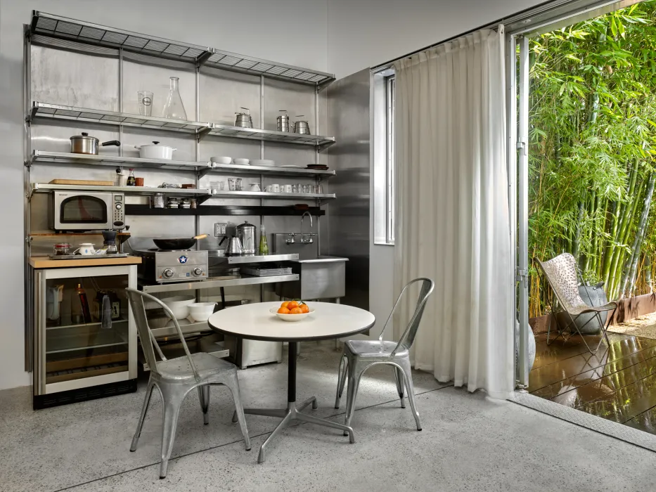 Small kitchen and dining table inside Shotwell Garden Retreat in San Francisco.