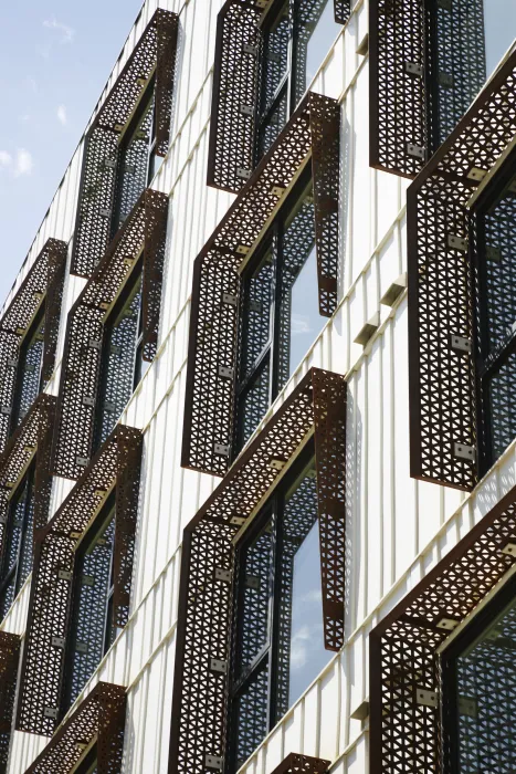 Random Batten Siding (RBS) and corten perforated sunshades detail at The Union in Oakland, Ca. 