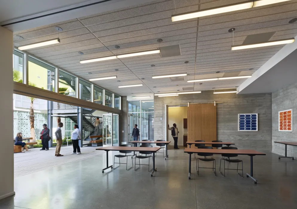 Community room looking out to the courtyard at Richardson Apartments in San Francisco.