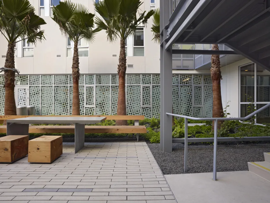 Courtyard table and stools at Richardson Apartments in San Francisco.