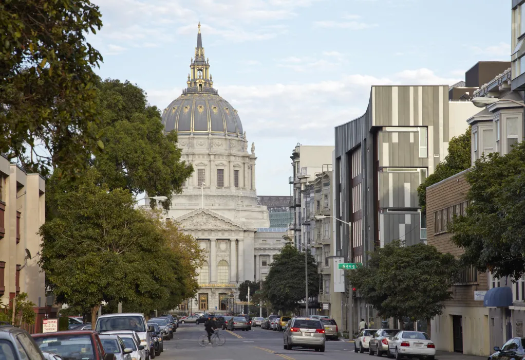 Looking down Fulton Street toward City Hall dome, showing the corner bay of Richardson Apartments in San Francisco.