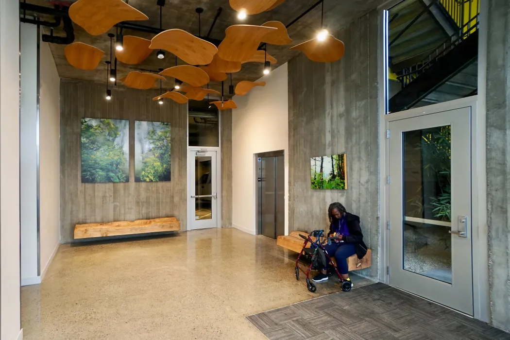 Custom sculpture and bench by DBA Workshop inside Coliseum Place, affordable housing in Oakland, Ca