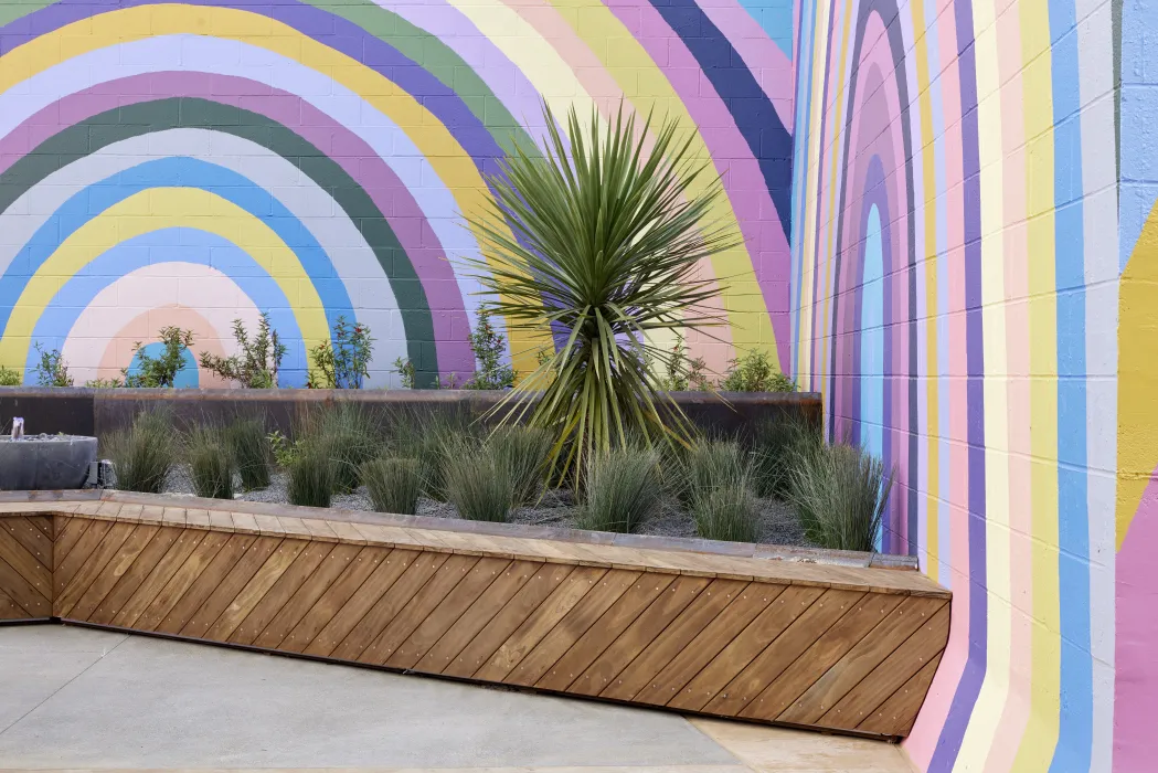 Rainbow mural in the courtyard at Tahanan Supportive Housing in San Francisco.