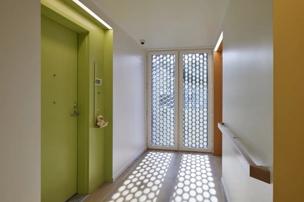 Residential hallway inside Tahanan Supportive Housing in San Francisco.