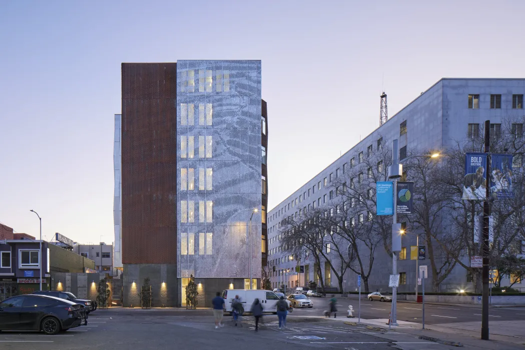 Exterior at dusk of Tahanan Supportive Housing in San Francisco.