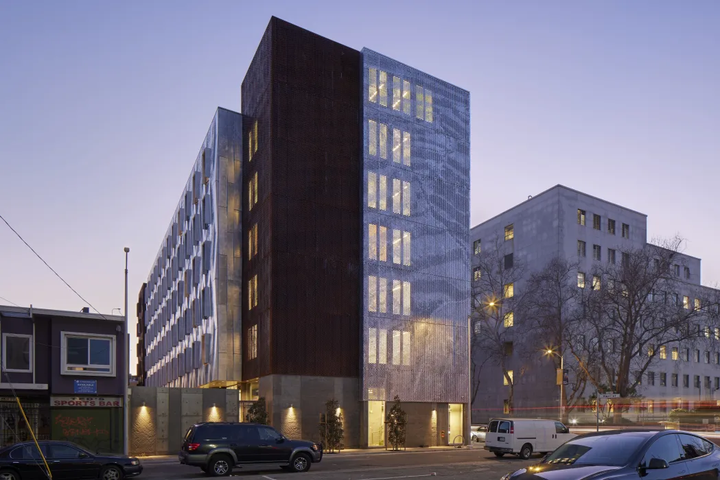 Exterior at dusk of Tahanan Supportive Housing in San Francisco.