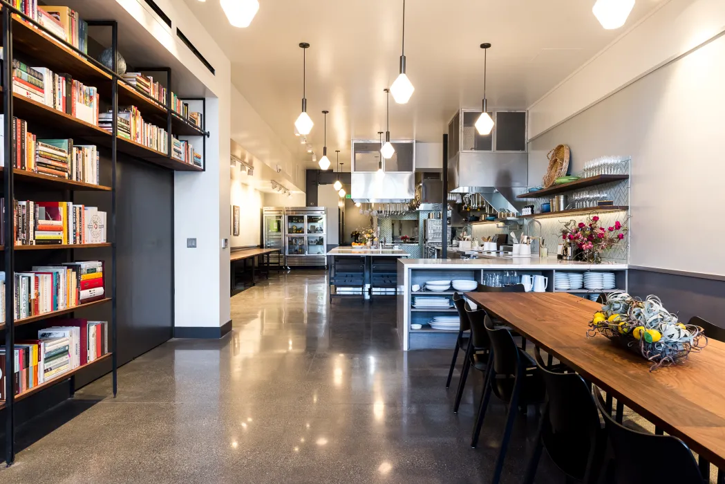 Custom adjustable height table and bookshelf at Civic Kitchen in San Francisco.