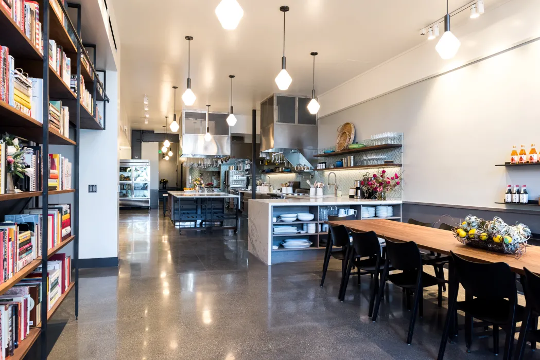 Custom adjustable height table and bookshelf at Civic Kitchen in San Francisco.