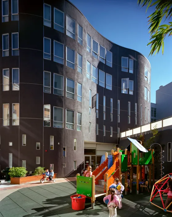 Children playing at the onsite daycare playground at 8th & Howard/SOMA Studios in San Francisco, Ca.