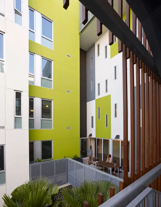 View from the open-air stairs of second-level outdoor community space at Richardson Apartments in San Francisco.