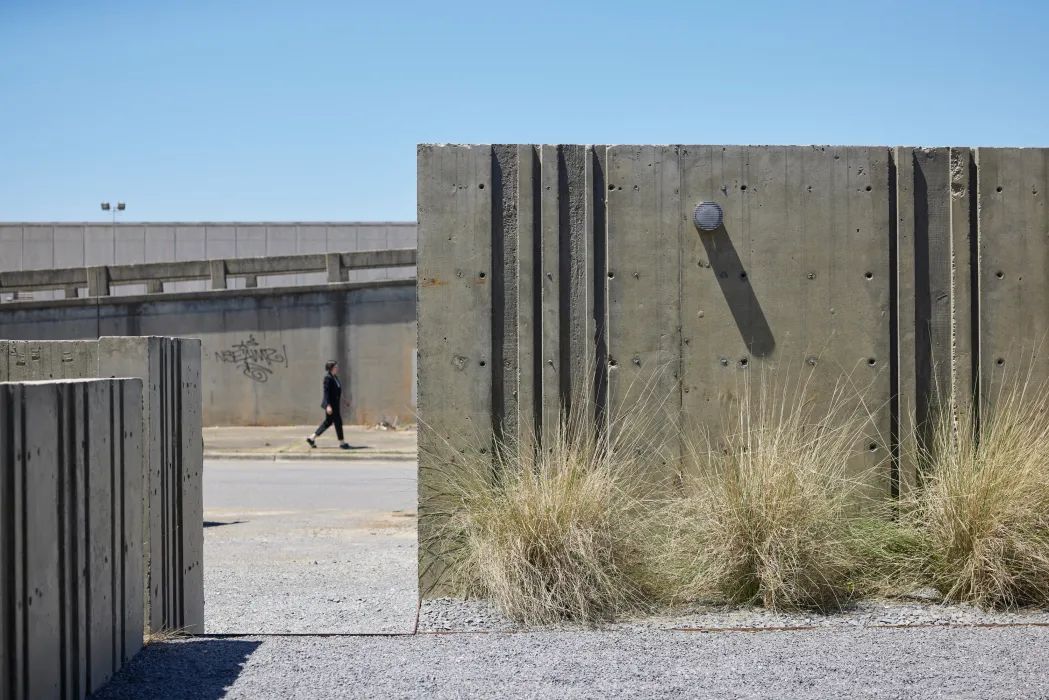 View of the rear courtyard with texture concrete walls at the Bandsaw Building in Birmingham, Alabama.