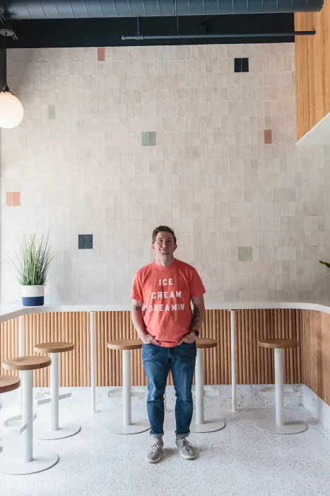 Man standing inside Big Spoon Creamery in Huntsville, Alabama.