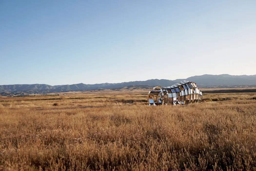 peepSHOW in the desert with mountains behind it in New Cuyama, California.