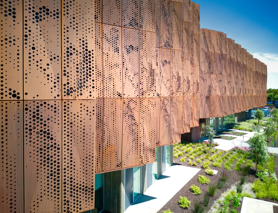 Detail view of the weathering cor-ten facade sunshades on the exterior of Blue Oak Landing in Vallejo, California.