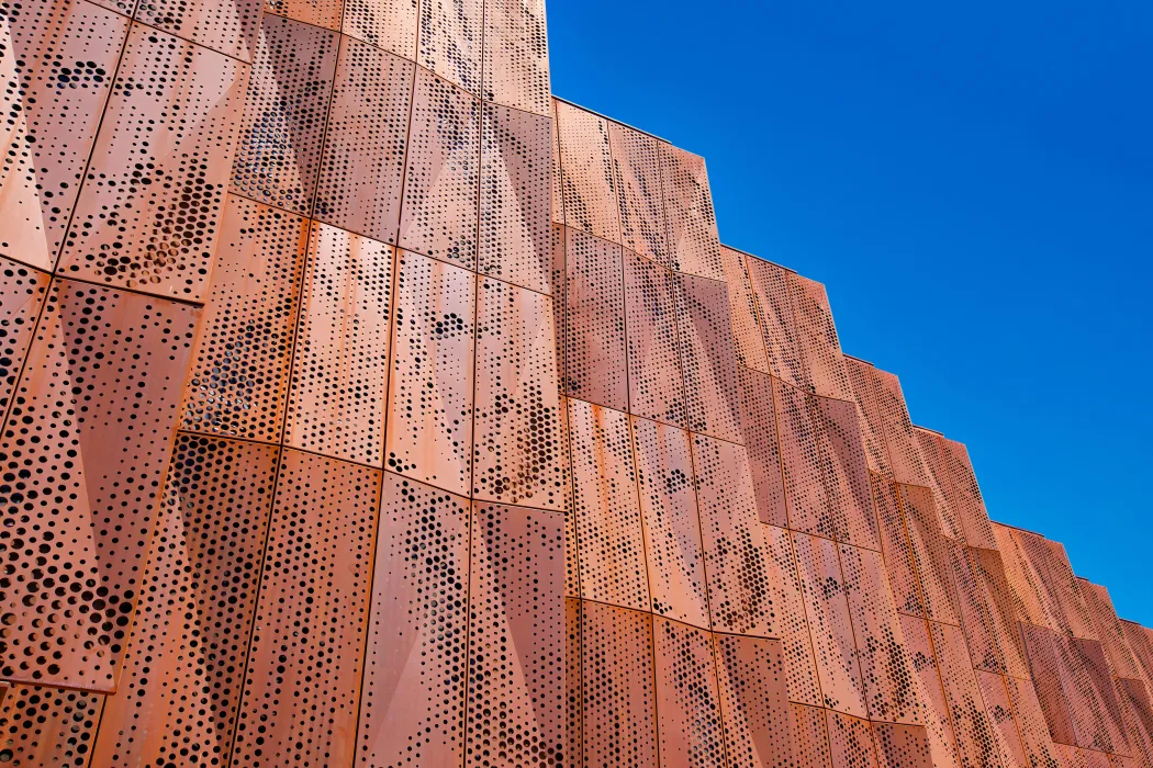 Detail view of the weathering cor-ten facade on the exterior of Blue Oak Landing in Vallejo, California.