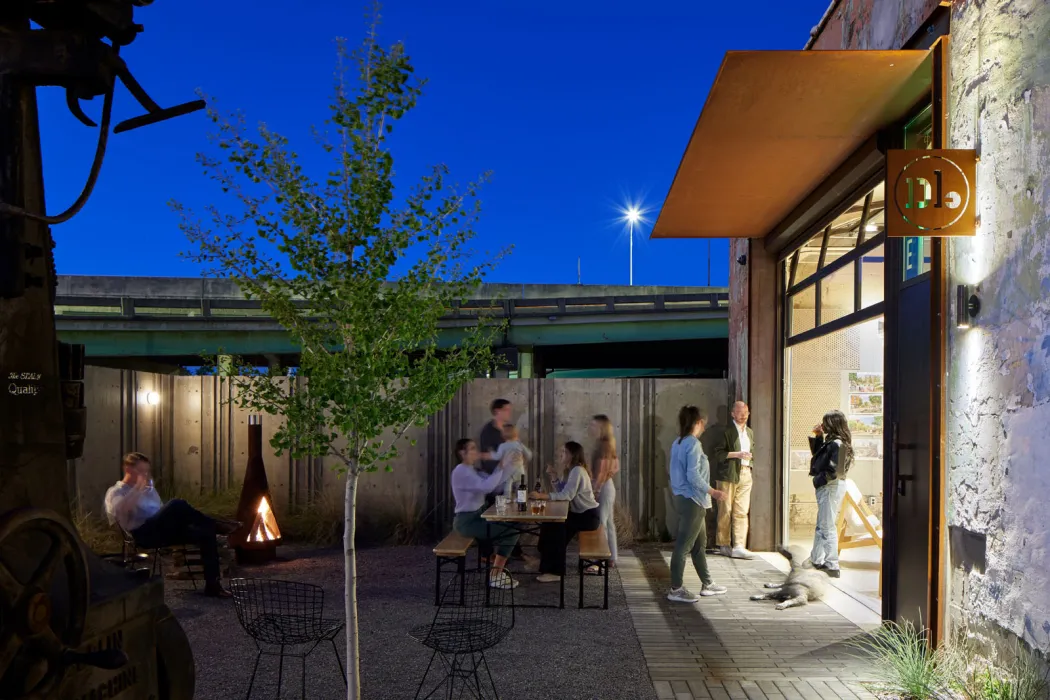 The Bandsaw Building courtyard at night with the DBA_BHM office doors open in Birmingham, Alabama.