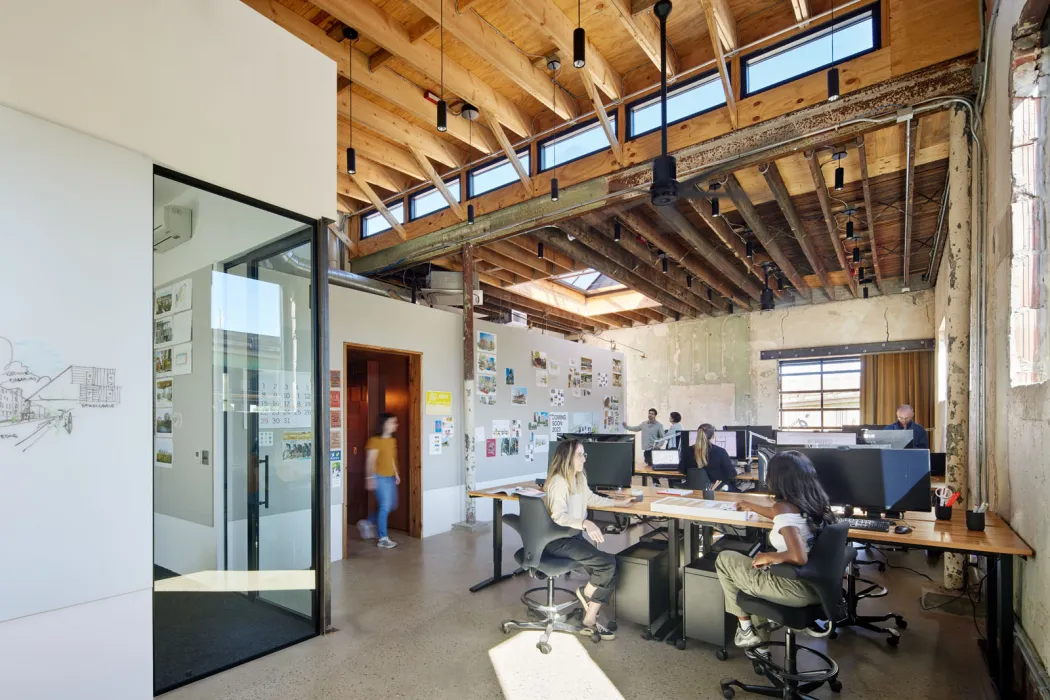 Office interior of DBA_BHM with staff working at the Bandsaw Building in Birmingham, Alabama.