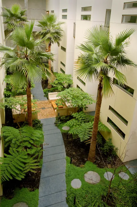 View of courtyard with conversation pit from above at Pacific Cannery Lofts in Oakland, California.