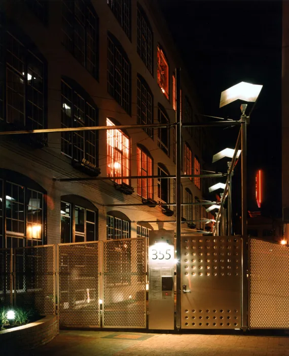 Entry gate at night at 355 Bryant Lofts in San Francisco.