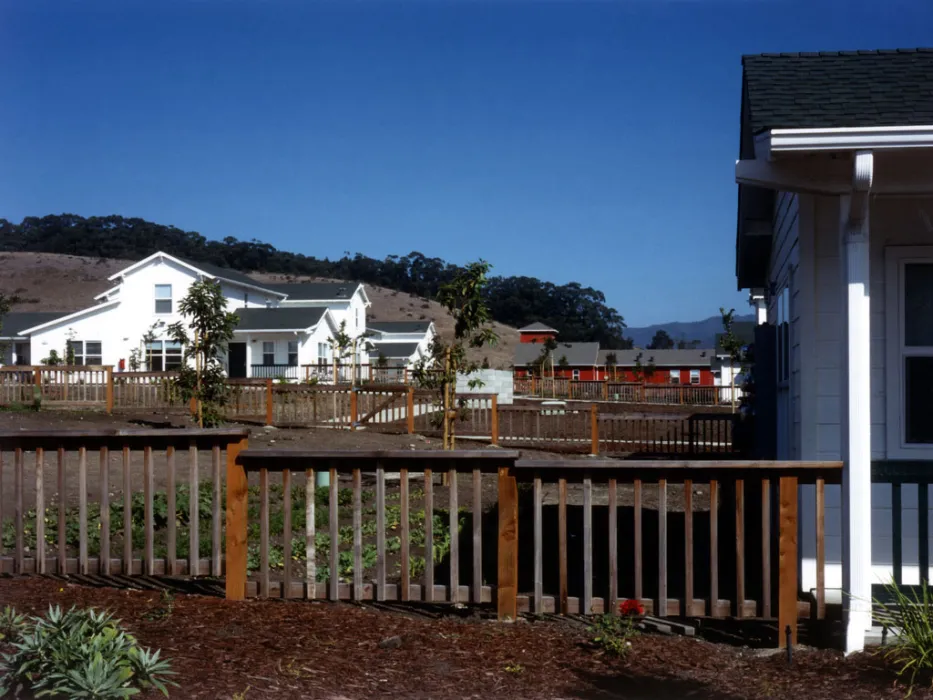 Community garden with townhouses in the background at Moonridge Village in Santa Cruz, California.