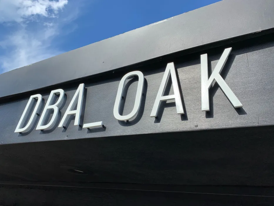 Detail of the DBA_OAK sign on the exterior of David Baker Architects Office in Oakland, California.