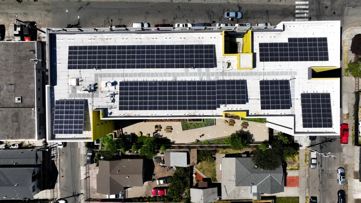 Aerial view showing the solar panels on the roof of Coliseum Place in Oakland, California.