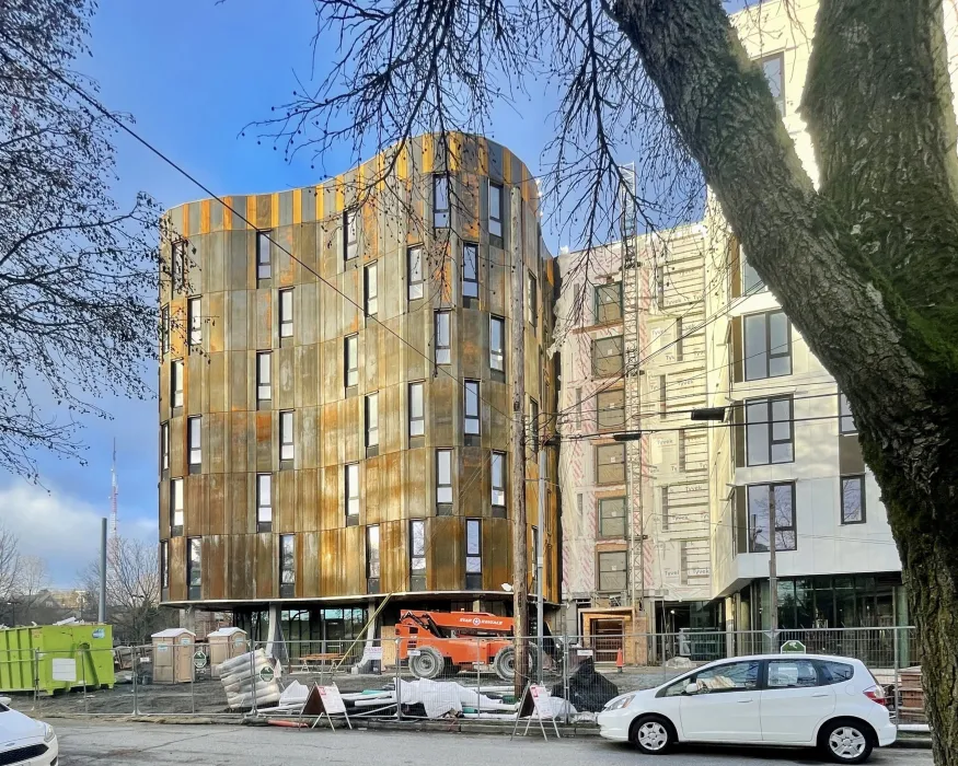 Construction of the cor-ten facade at Africatown Plaza in Seattle, Washington.