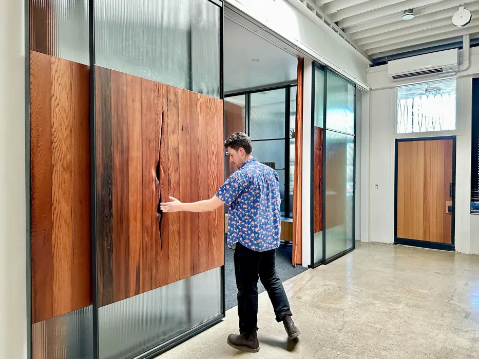 DBA_OAK sliding doors separating the conference room.