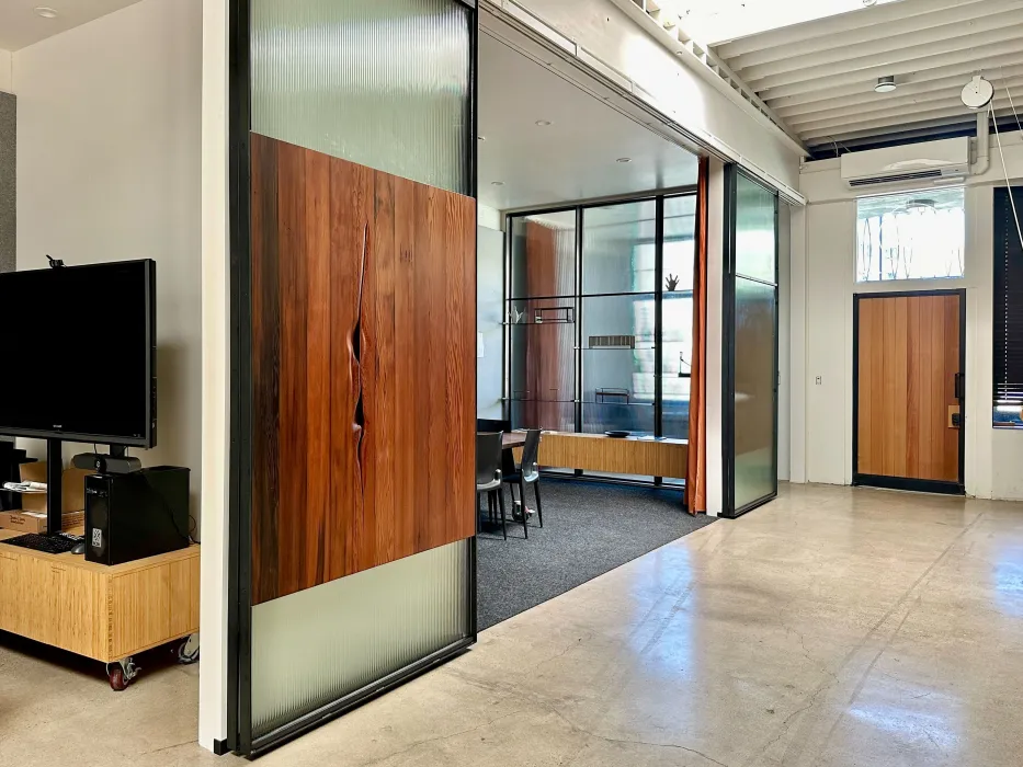 DBA_OAK sliding doors separating the conference room.